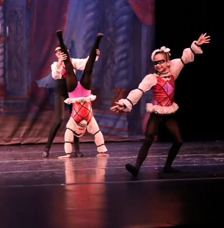 Character dancers in colorful costumes performing The Nutcracker